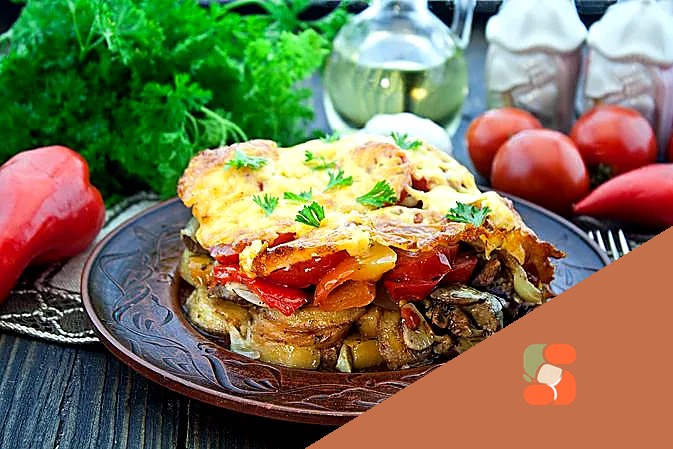 Куряча печінка, запечена з овочами, під сиром